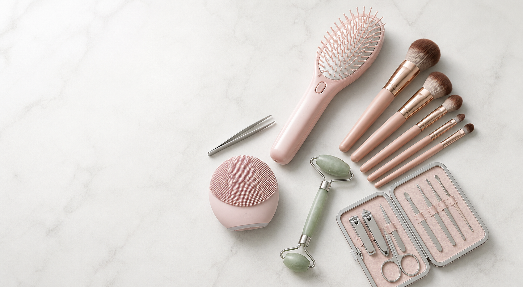 Beauty brushes and care tools arranged on a clean stone surface